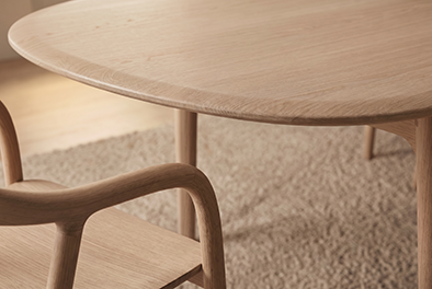 HAERE Table — a low timber table with a softly tapered edge.